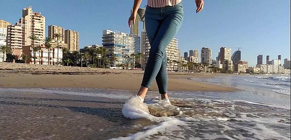  Wet shoot on a public beach with Crazy Model. Risky outdoor masturbation. Foot fetish. Pee in jeans.